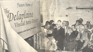 In this 1987 Frederick News-POst photo, George Delaplaine, Jr. (center), Bettie Delaplaine (right), and Governor William Donald Schaefer (left) unveil the sign announcing the future home of The Delaplaine Arts Center.