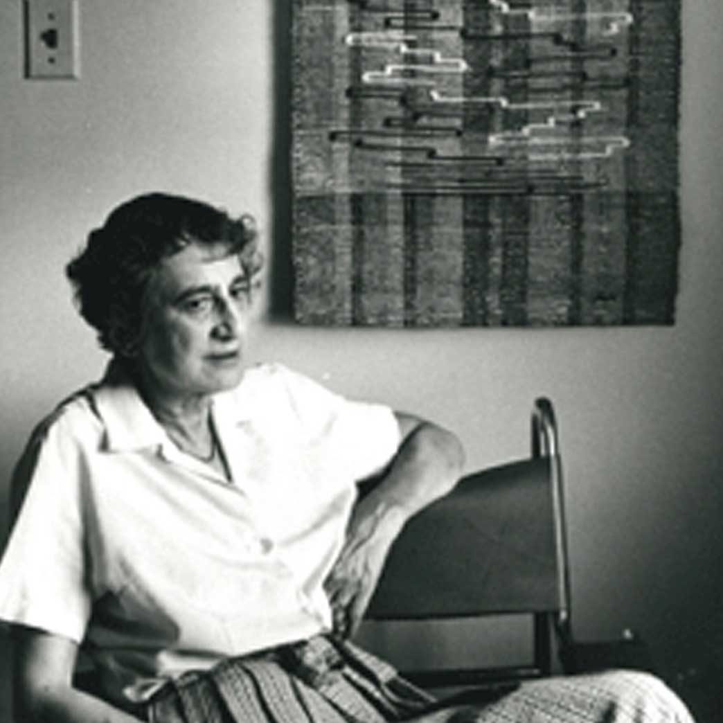 Anni Albers with Scroll, October 3, 1965. ​​Photograph by New Haven Register. ​​Gelatin silver print. ​​ © 2020 The Josef and Anni Albers Foundation/Artists Rights Society (ARS), NY